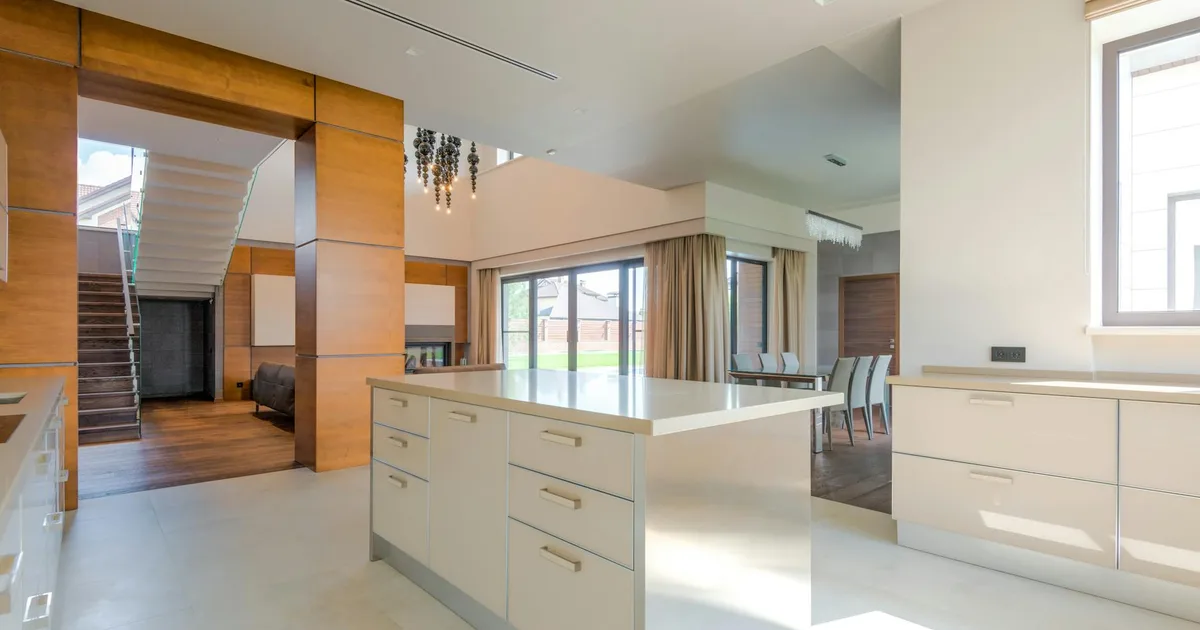 Spacious modern kitchen interior blending minimalist design and natural light.