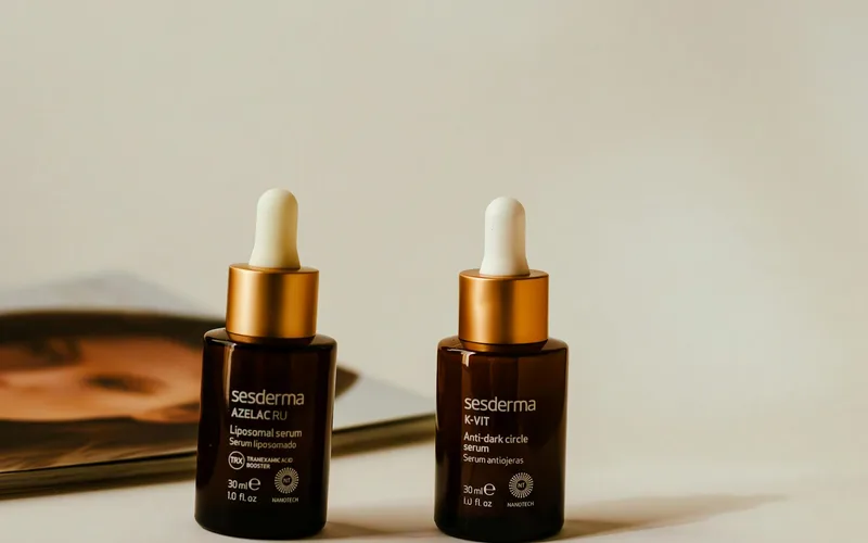 Liposomal and anti-dark circle serums showcased in stylish amber bottles with droppers.