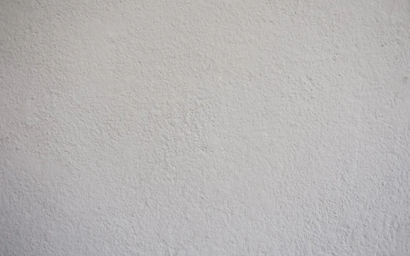 Close-up of a textured white wall, ideal for background or copyspace use.