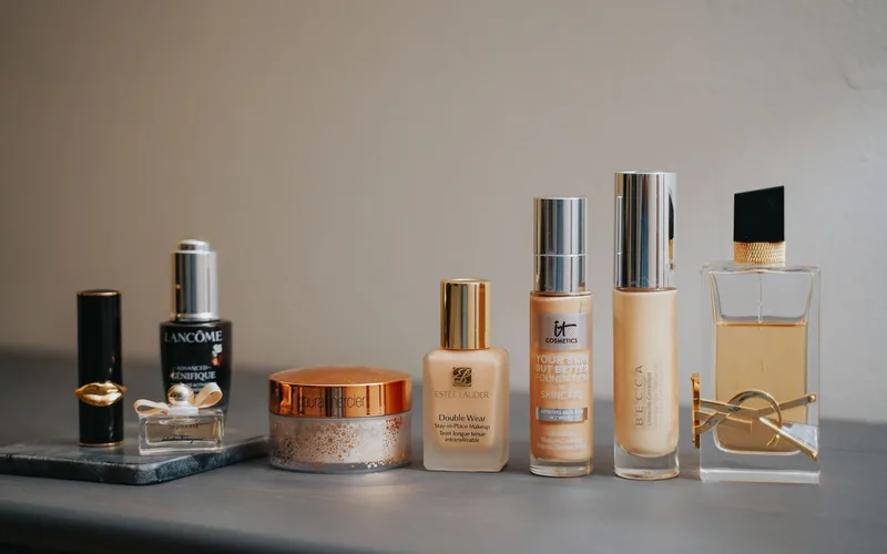 A stylish display of various beauty products including makeup and perfume bottles.