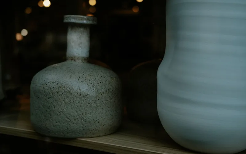 Artistic close-up of rustic ceramic vases showcasing texture and form.
